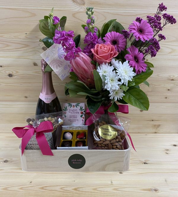 Hamper with flowers, wine, and chocolates