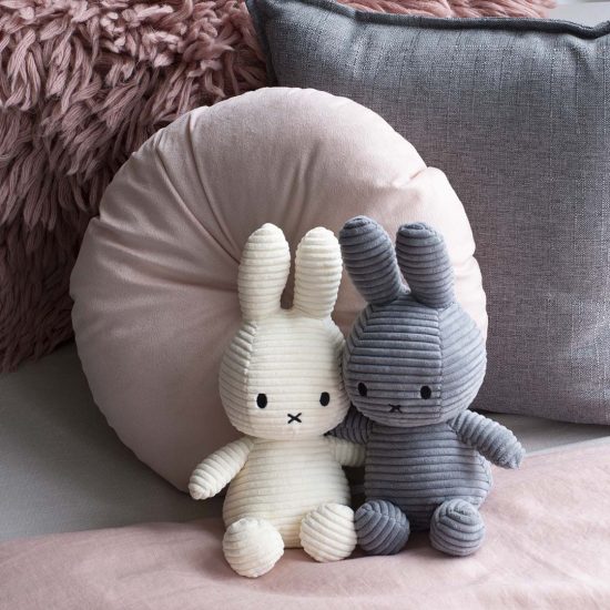 White plush rabbit and grey plush rabbit