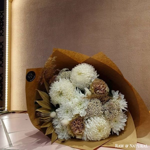 Bouquet of flowers wrapped in paper