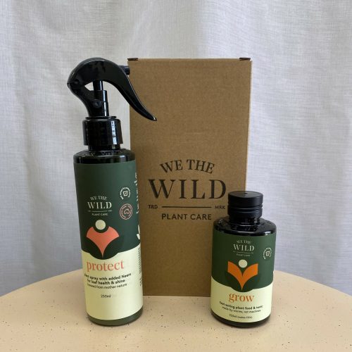 Two bottles of plant care product and a cardboard box